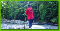 River transportation through one of the Malaysia rainforests